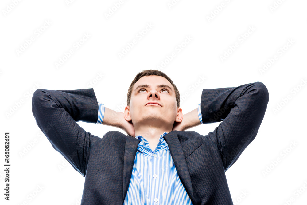 Portrait of a dreaming young businessman about a big successful business on a white background Portrait of a dreaming young businessman about a big successful business on a white background