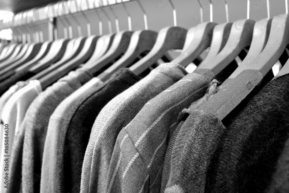 Obraz premium Dresses of wool and cotton hanging in a row