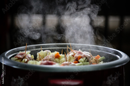 Pork and vegetables in Shabu pot is very hot and many smoke.