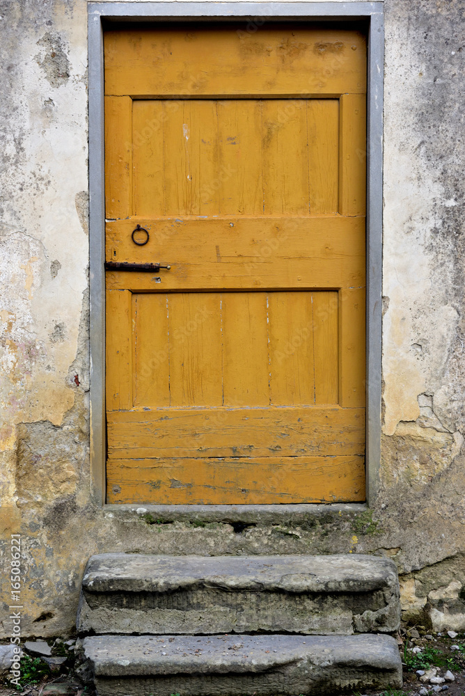 yellow rural countryside closed wooden door