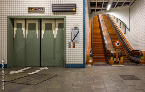 Lift and wooden escalators in the Sint-Anna Pedestrian Tunnel in Antwerp, Belgium.