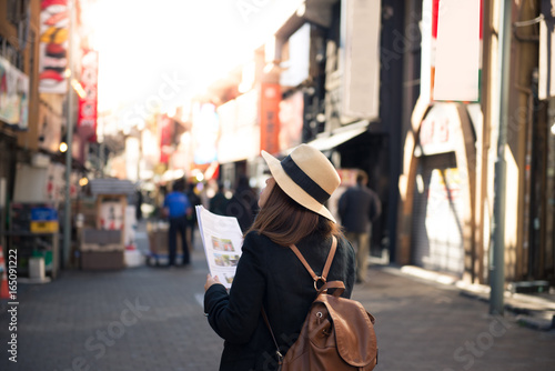 Tourist is traveling into market in Tokyo, Japan.