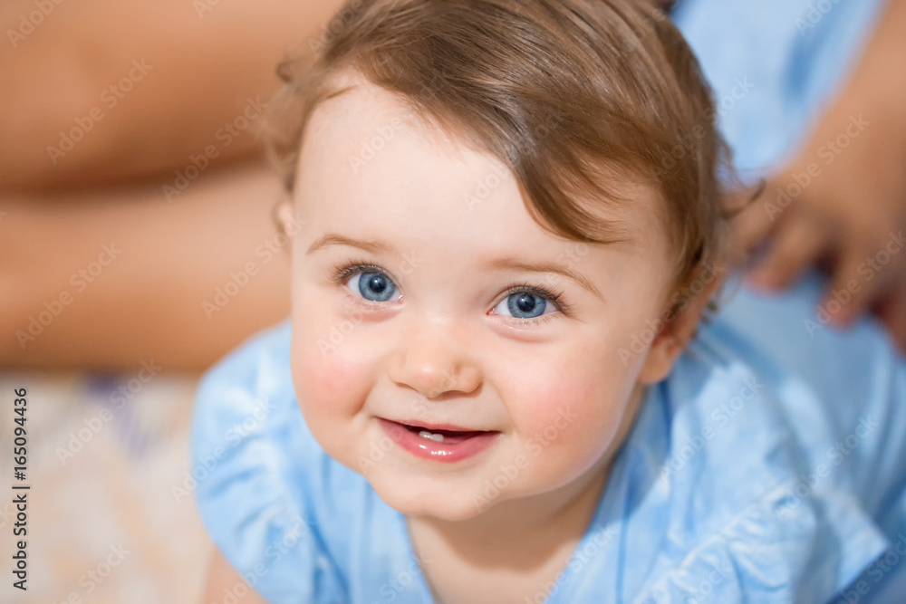 Newborn baby girl smiling with two lower teeth. Newborn baby girl smiling with two lower teeth.