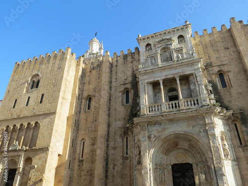 Portugal - Coimbra - Façade Nord de Sé Velha, ancienne cathédrale avec la porte especiosa et le clocheton photo