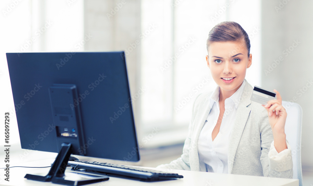 businesswoman with computer using credit card businesswoman with computer using credit card