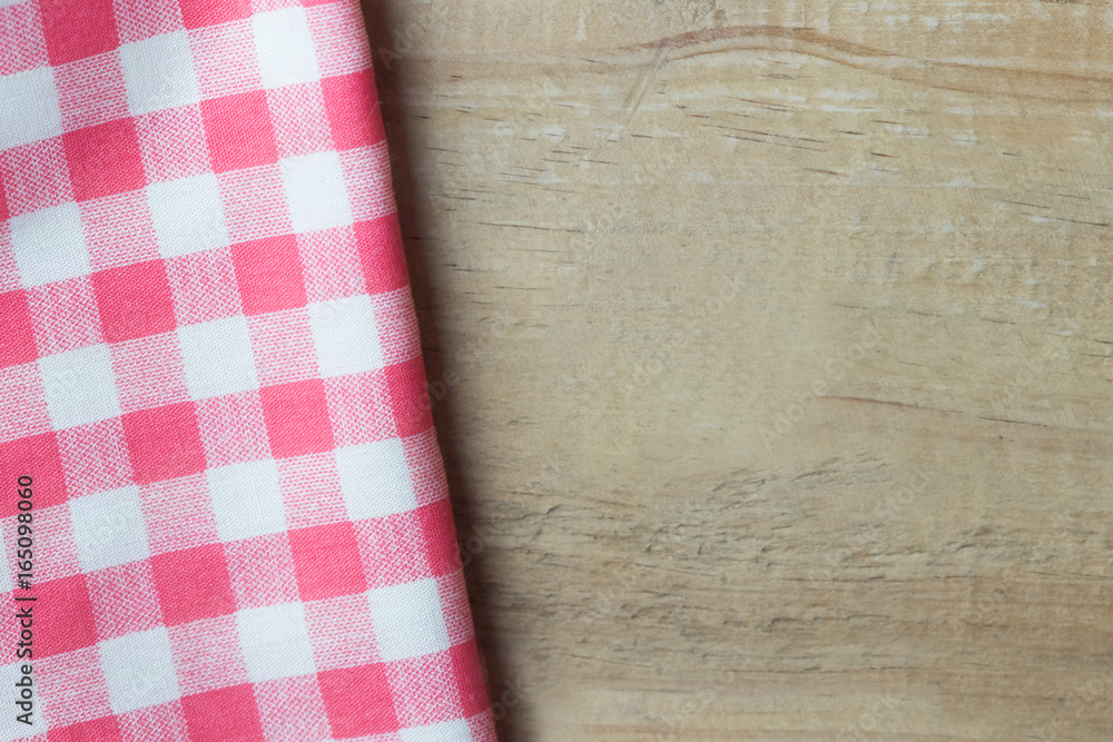 Red napkin on wooden table top angle view Red napkin on wooden table top angle view
