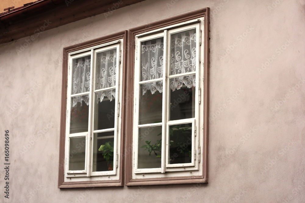 Two small windows with curtains