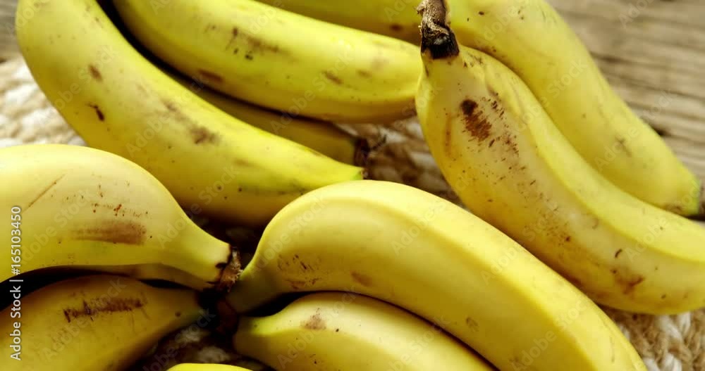 Fresh bananas on wooden plank Fresh bananas on wooden plank