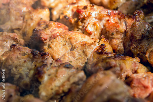 Quadro em tela Sven shashlik closeup mashed slices of meat put on metal skewers roasted on char