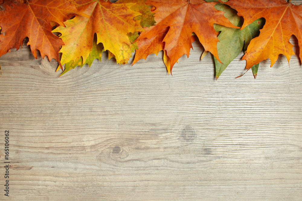 Autumn Leaves frame over wooden background Autumn Leaves frame over wooden background