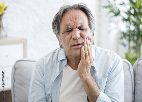 Old man with toothache photo