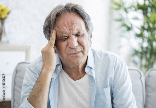 Old man with headache photo