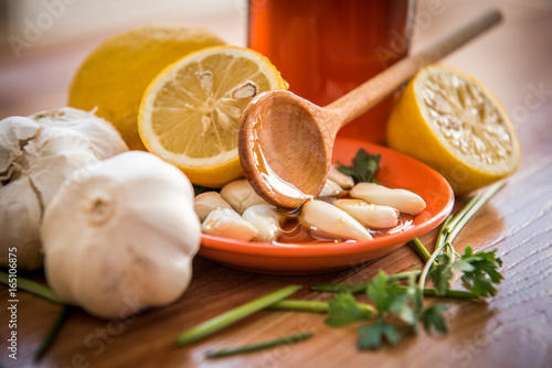Organic vegetables antioxidant diet with garlic lemon honey and leaves of parsley 
