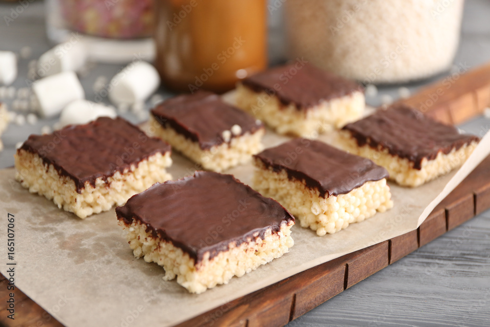Rice crispy treats on wooden board Rice crispy treats on wooden board