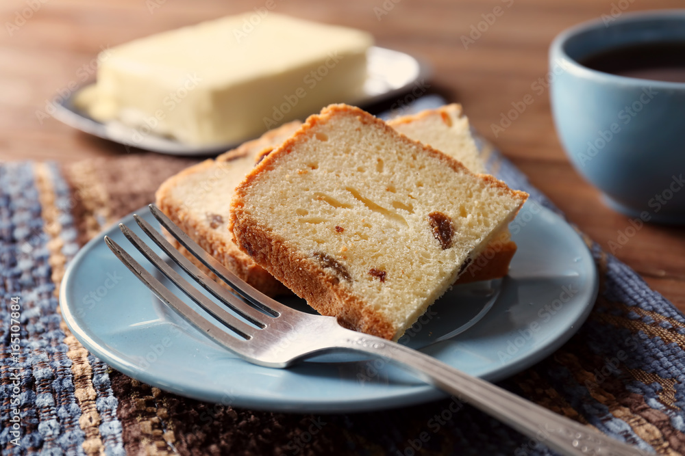 Plate with delicious sliced butter cake on table Plate with delicious sliced butter cake on table
