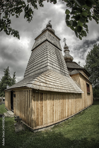 Wooden church in village Ladomirova, Slovakia photo