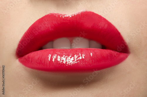 Beautiful young woman with bright lips, closeup