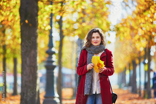Beautiful young girl in autumn park