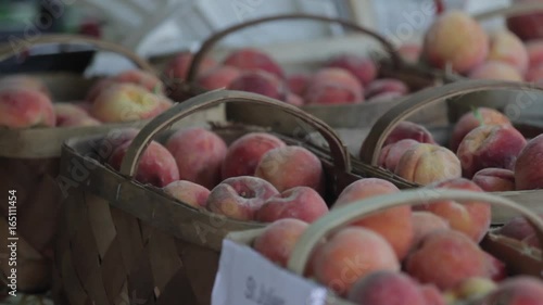 Baskets of delicious peaches for sale at a farmers market