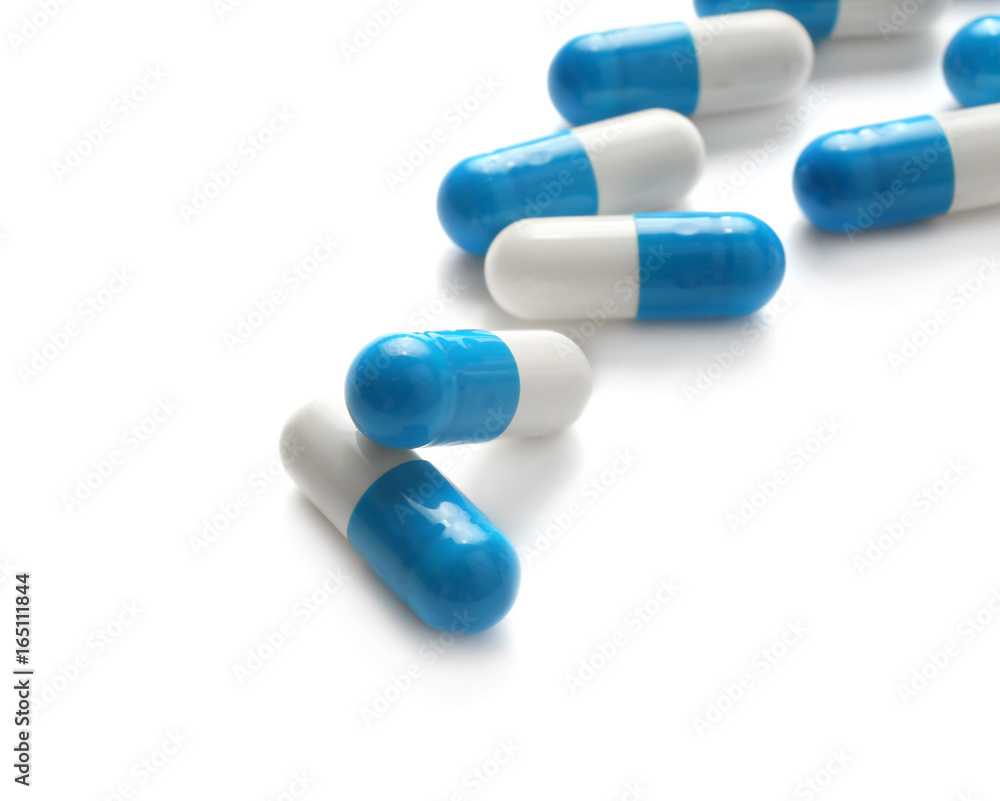Health care concept. Colorful pills on white background Health care concept. Colorful pills on white background