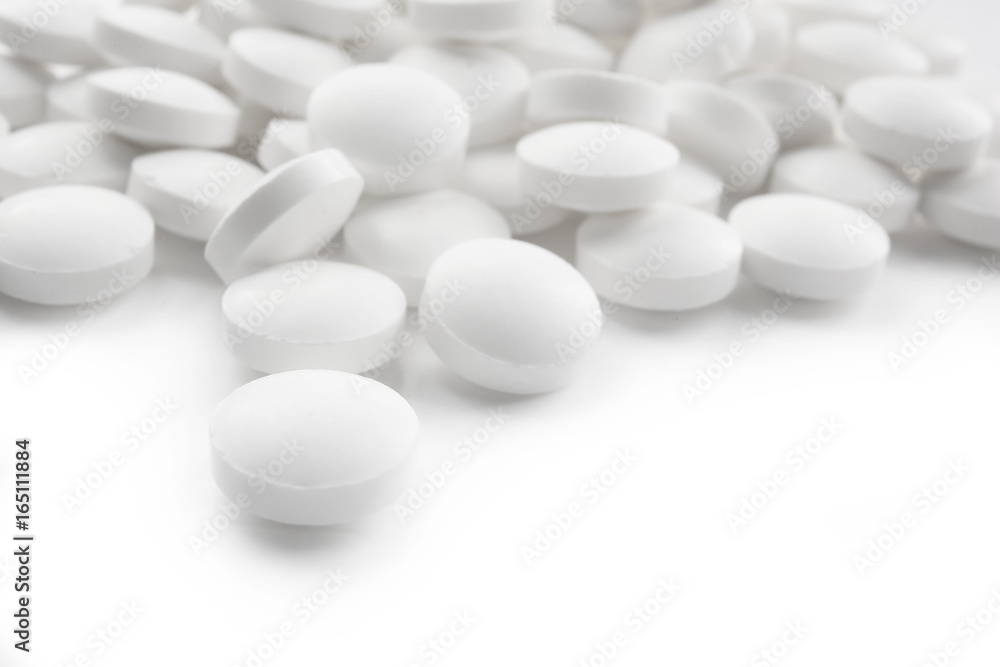 Health care concept. Round pills on white background