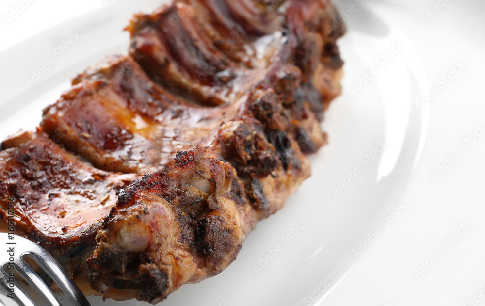 Plate with delicious pork ribs, closeup Plate with delicious pork ribs, closeup