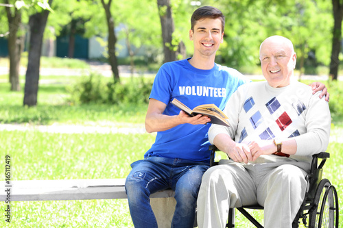 Young male volunteer readin...