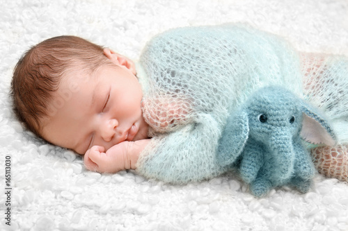 Sleeping newborn baby boy w...