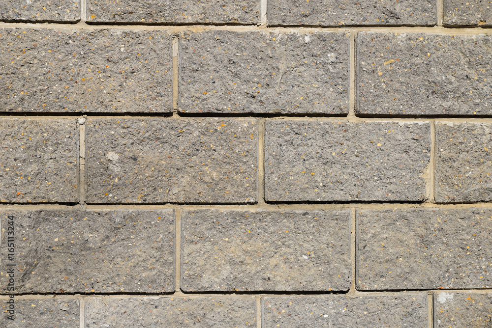 Gray bricks wall texture with yellow spots for wallpapers, background, design, template, patterns Gray bricks wall texture with yellow spots for wallpapers, background, design, template, patterns