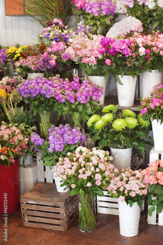 Beautiful peonies and other flowers in shop