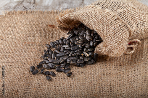 Sunflower seeds in a sack on burlap. photo