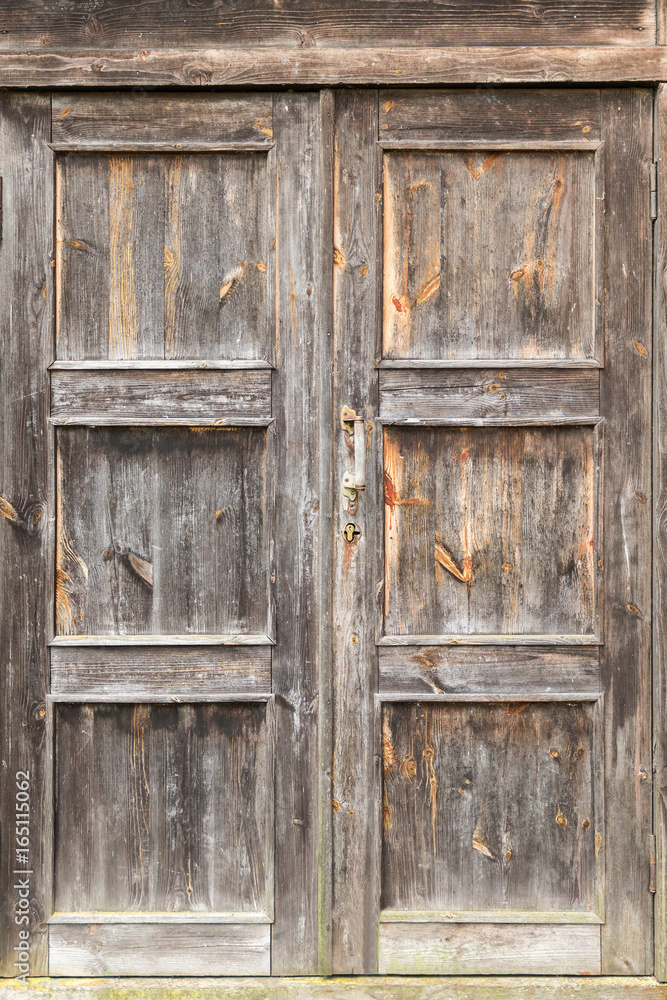 Obraz premium Vintage rustic weathered wooden door texture