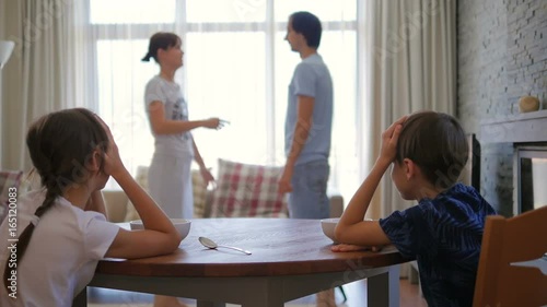 Parents quarrel. Children watch as a scold parents. A quarrel in the family.