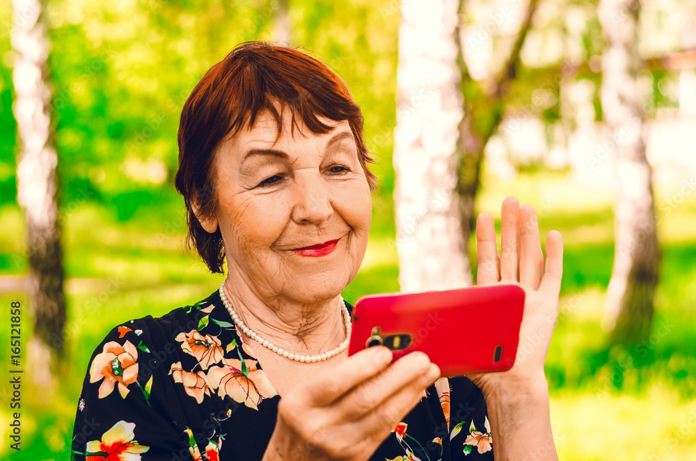 Grandmother watching the wireless internet news Grandmother watching the wireless internet news