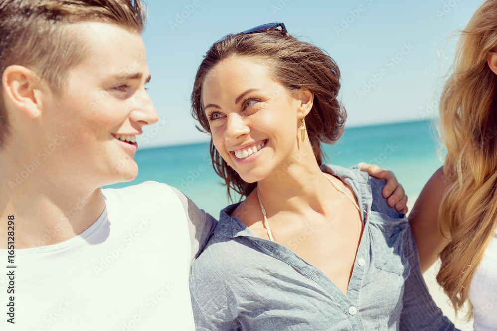 Company of young people on the beach