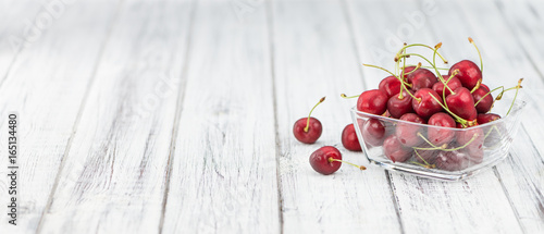 Cherries on wooden background; selective focus