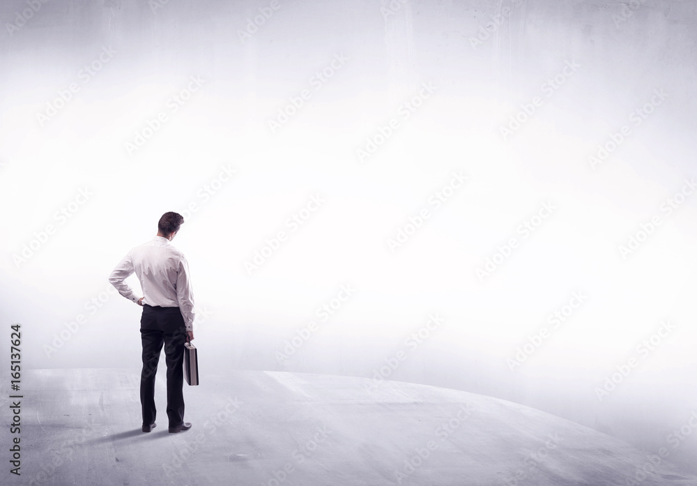 Business person standing from rear view Business person standing from rear view