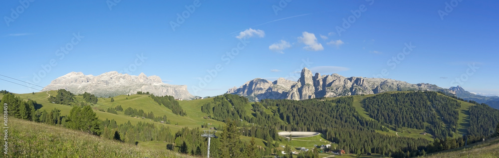 Fototapeta premium Great landscape on the Dolomites. View on Sella group, Bo peak, Gardenaccia massif and Sassongher summit. Alta Badia, Sud Tirol, Italy