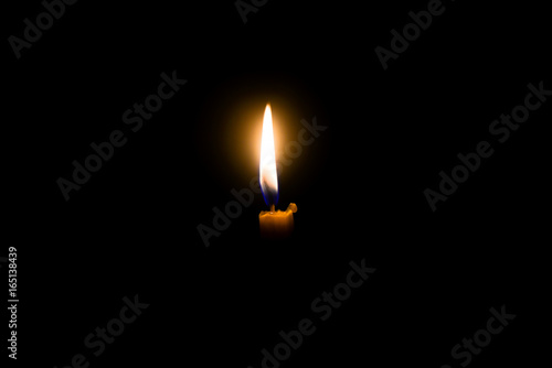 Candle on black background.