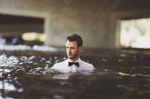 tuxedo shirt and bow tie in river