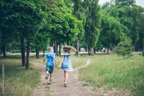 Two Little Kids Running in the pak