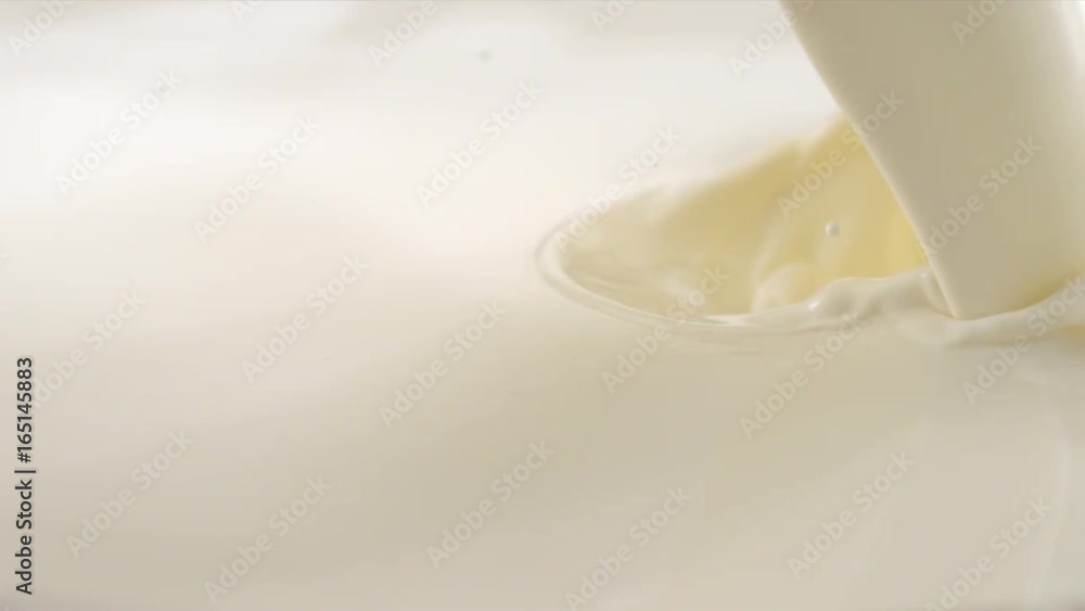 Pouring Milk closeup. Milk Splesh Slow Motion. Pouring Milk closeup. Milk Splesh Slow Motion.