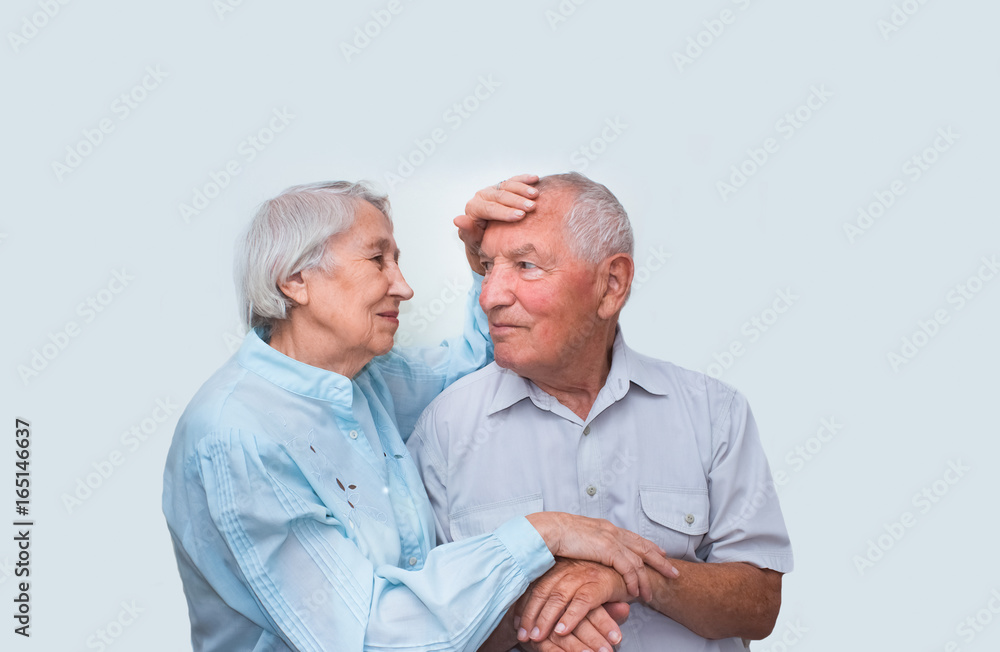 The elderly couple on studio background