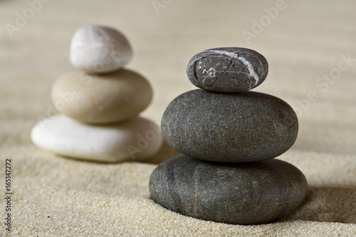 Dark and white piles of balanced stones