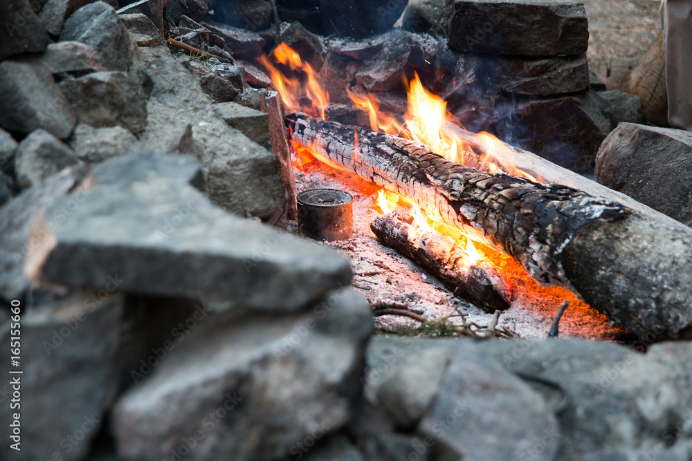 A bonfire with a can in the stones A bonfire with a can in the stones