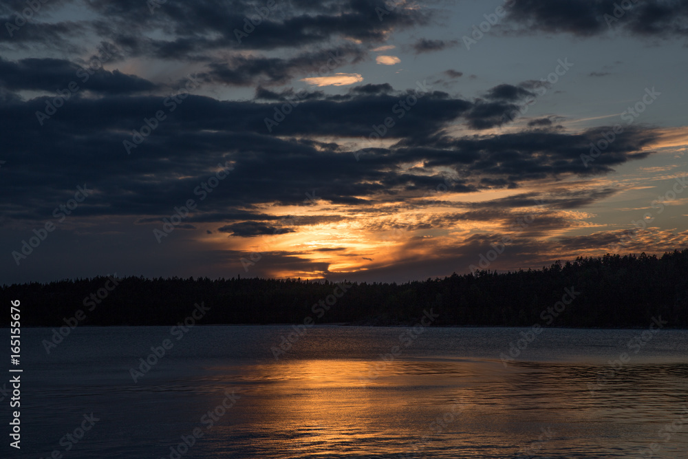 Sunset over the lake and forest