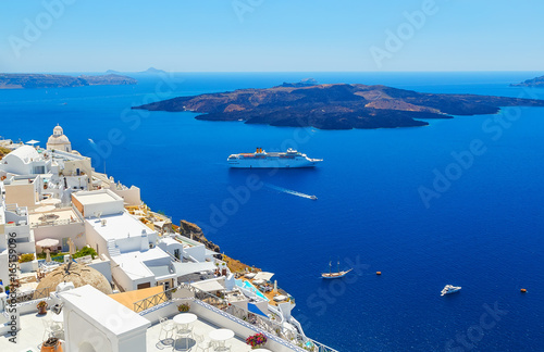 White architecture on Santorini island, Greece. Beautiful landscape with ship and sea view