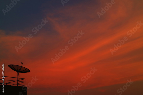 Incredible Vibrant Color Tropical Sunset Sky with the Silhouette of Satellite Dish
