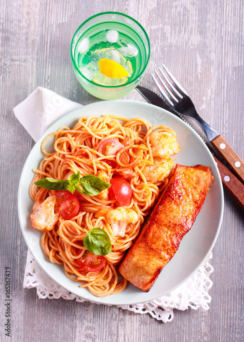 Fried trout fish and spaghetti