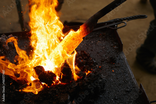 Red hot iron in the blacksmith fire